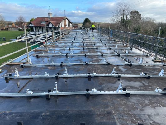 Solar panel mounting rails fitted across the roof at Kidderminster Cricket Club