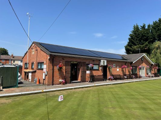 Full view of Worcester Bowls Club clubhouse with its rooftop solar panel system