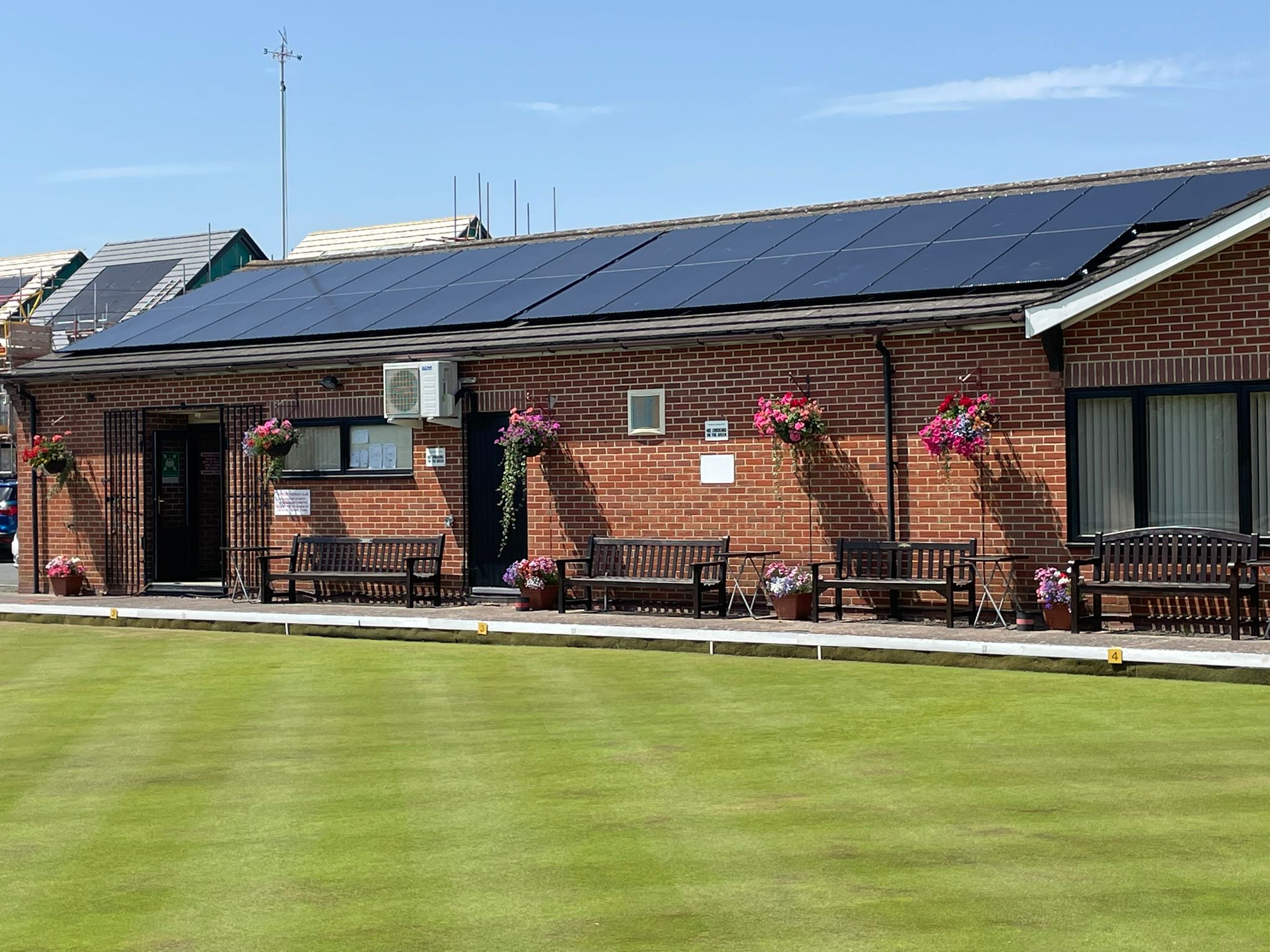 Roof-mounted solar panels overlooking the bowling green at Worcester Bowls Club